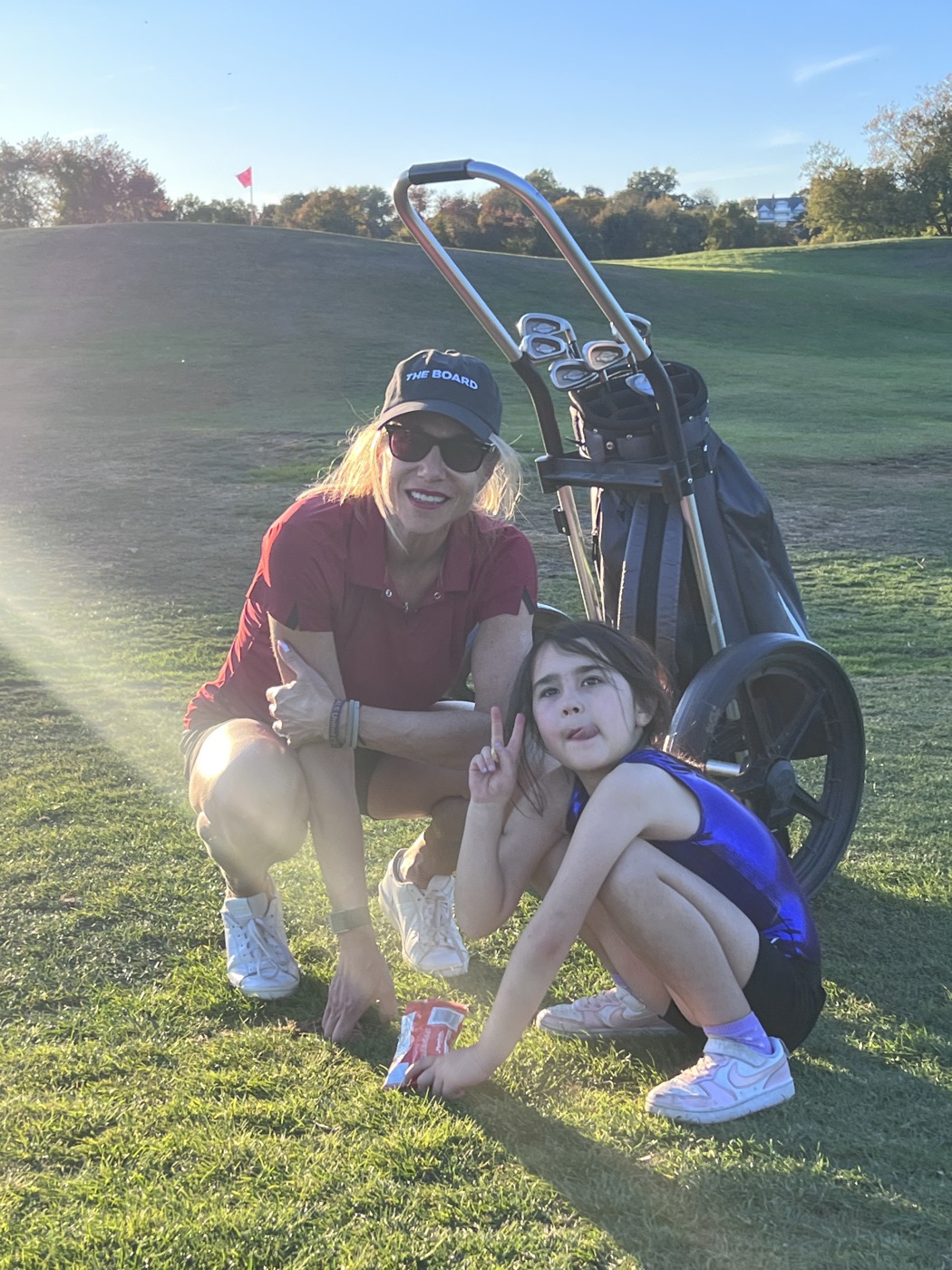 Loree and Ava golfing
